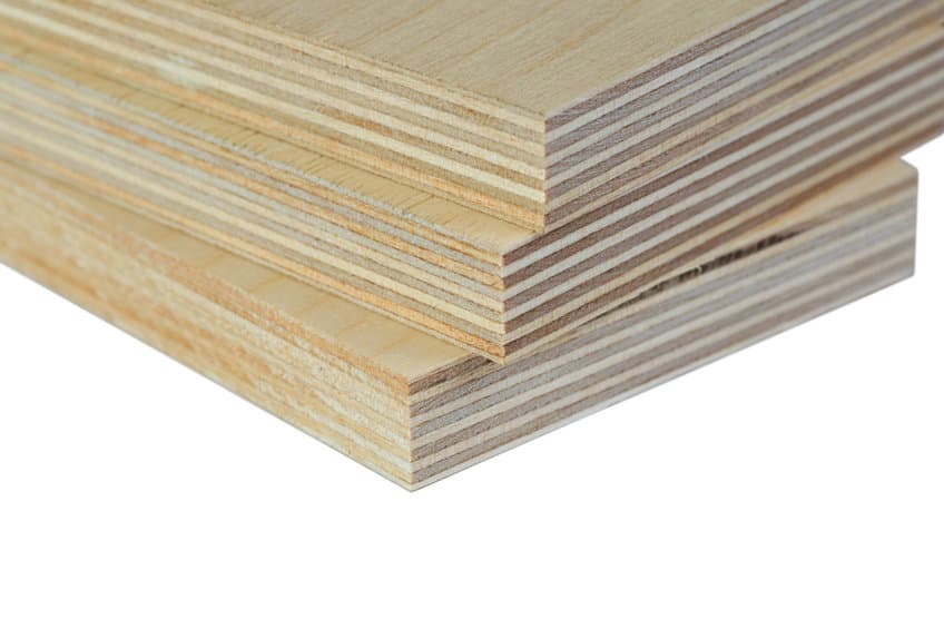 Macro isolate three light plywood boards stacked